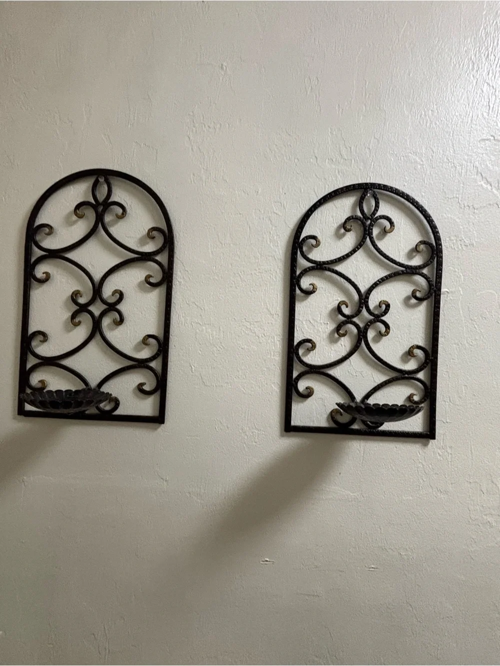 Two vintage iron scroll wall sconce candle holders